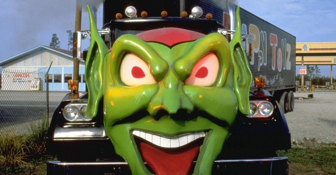 A truck with an evil green goblin on the front